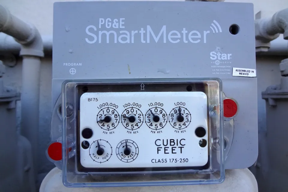 Close-up on PG&E "SmartMeter" electricity meter on side of building.